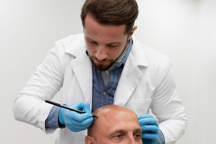 Surgeon Performing Hair Transplant Procedure