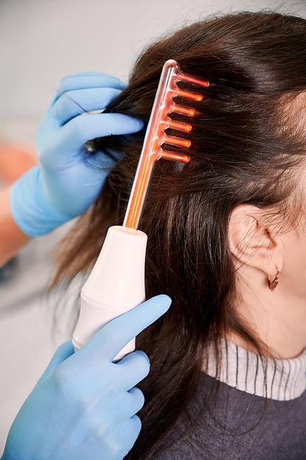 A skilled individual performing a root massage